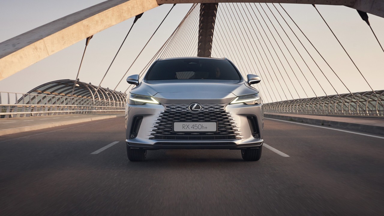 Front view of the Lexus RX driving on a bridge