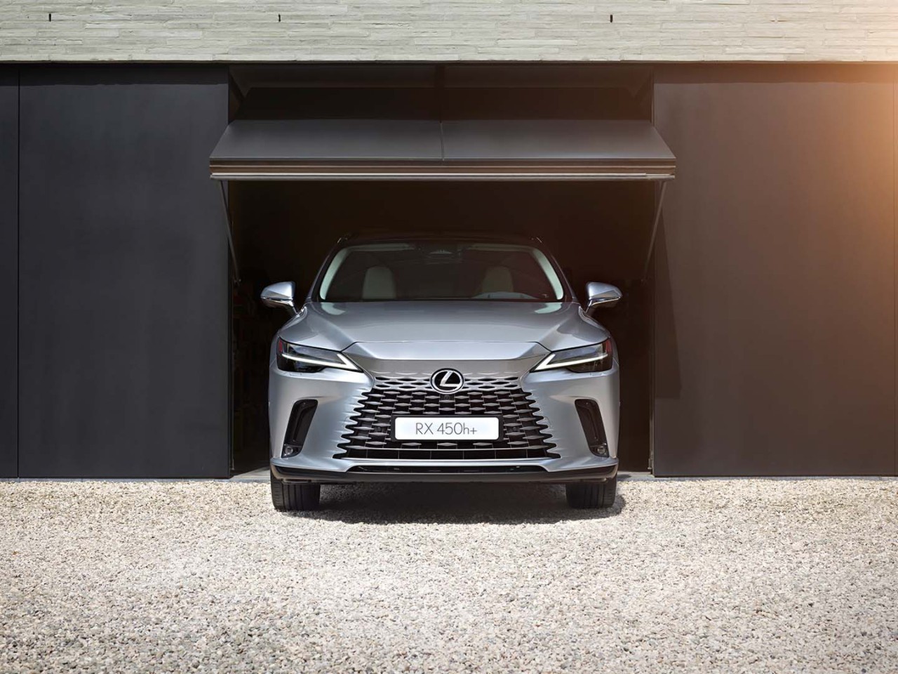 The Lexus UX driving in a town location