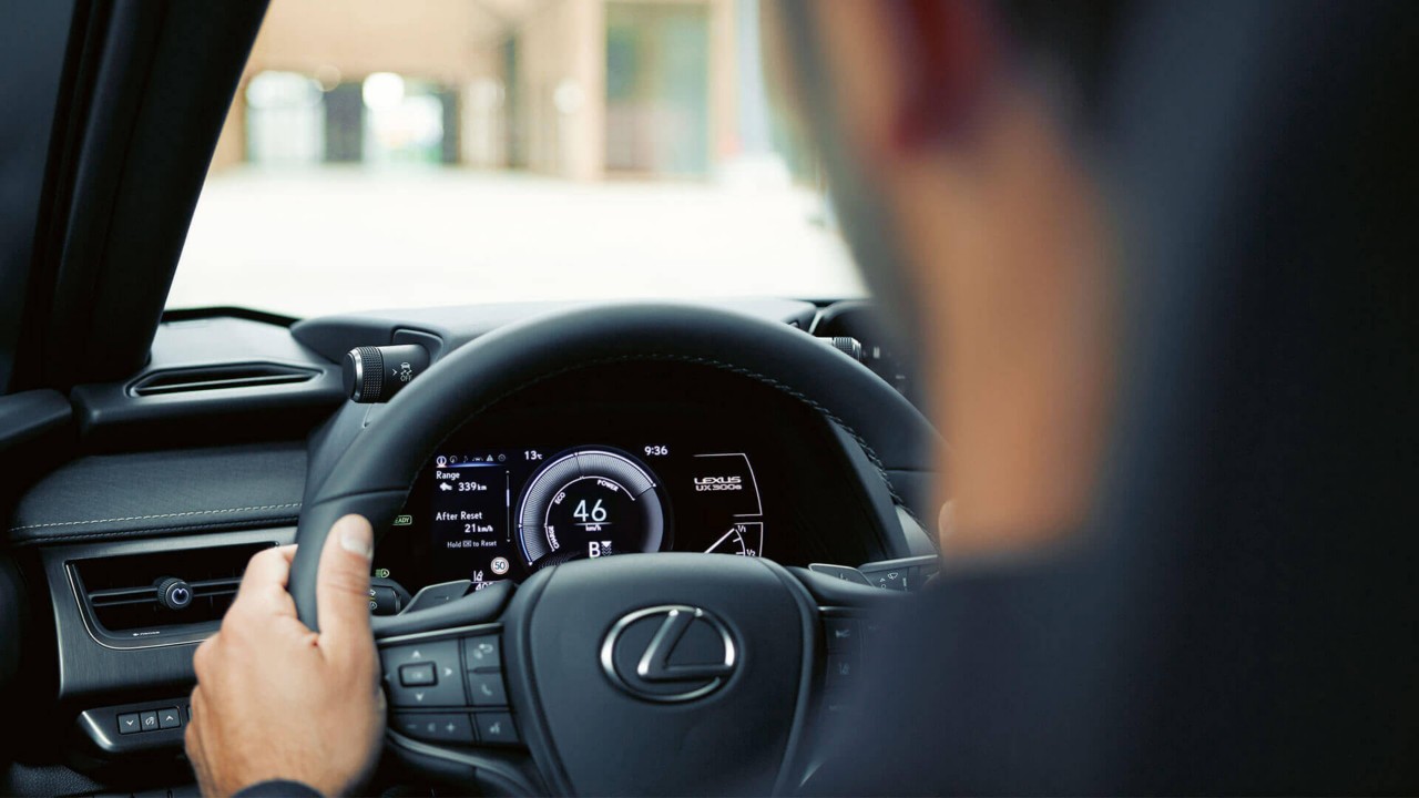 A man driving a Lexus UX 300e 