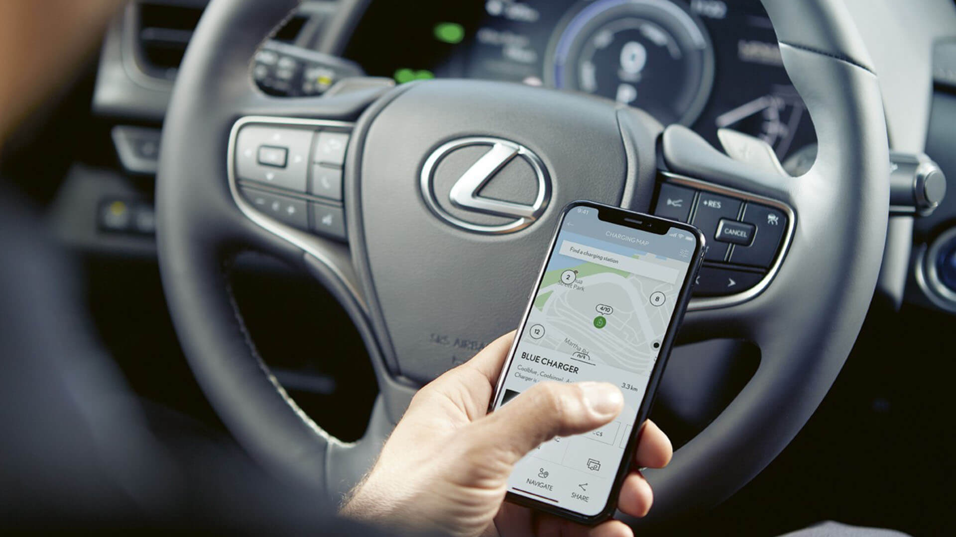 A person using the Lexus Link app sat within a Lexus
