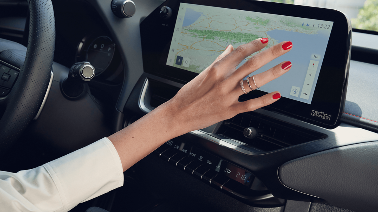  A women interacting with the Lexus UX's navigation system